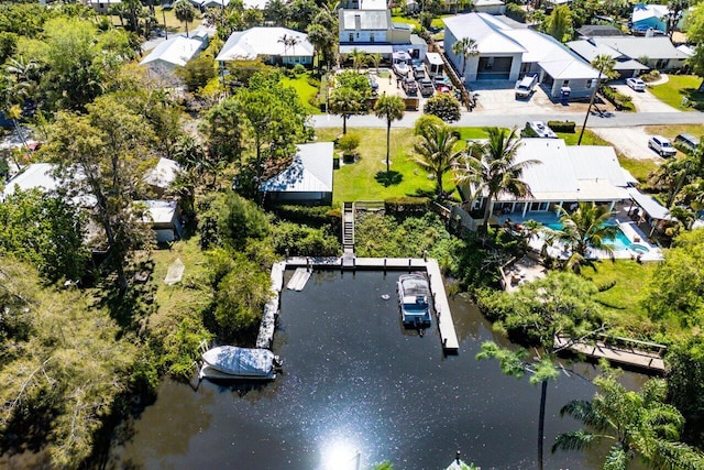 drone / aerial view with a residential view and a water view