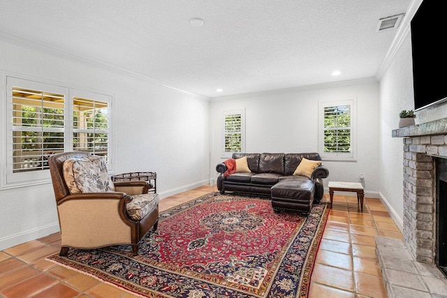 living room with baseboards, visible vents, a textured ceiling, crown molding, and a brick fireplace