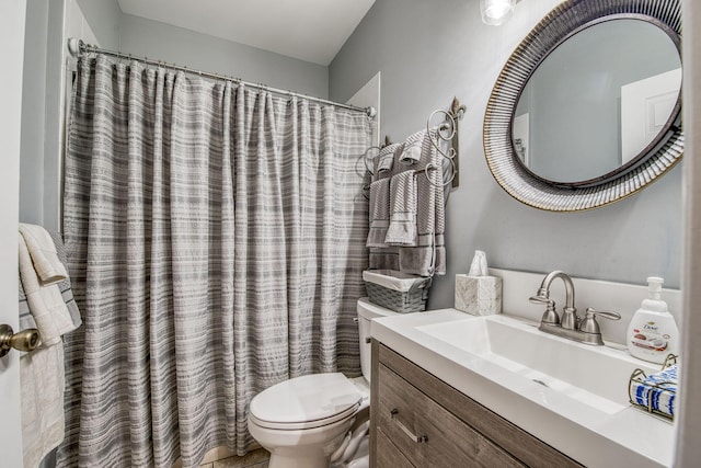 bathroom with a shower with curtain, toilet, and vanity