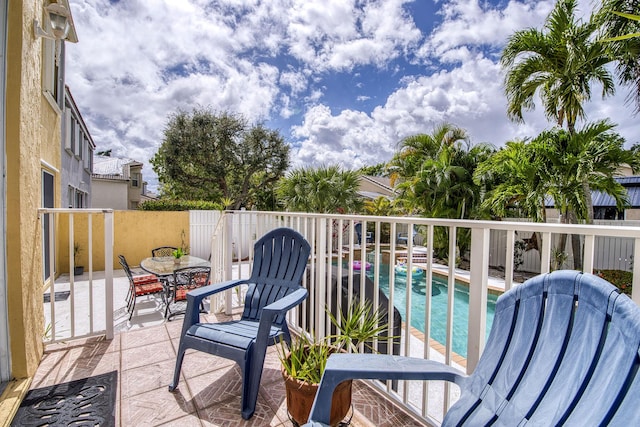 balcony featuring a patio and outdoor dining area