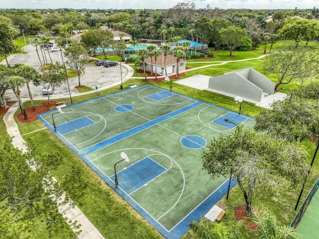 view of sport court with community basketball court and a lawn