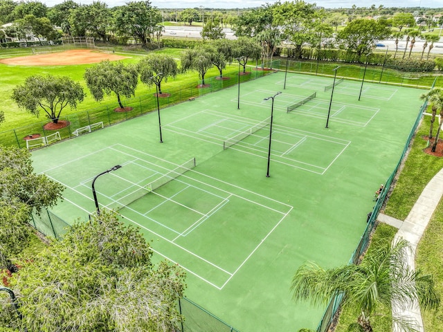 view of tennis court with fence