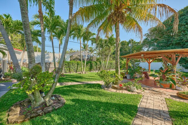 view of yard with a gazebo, a patio, and fence