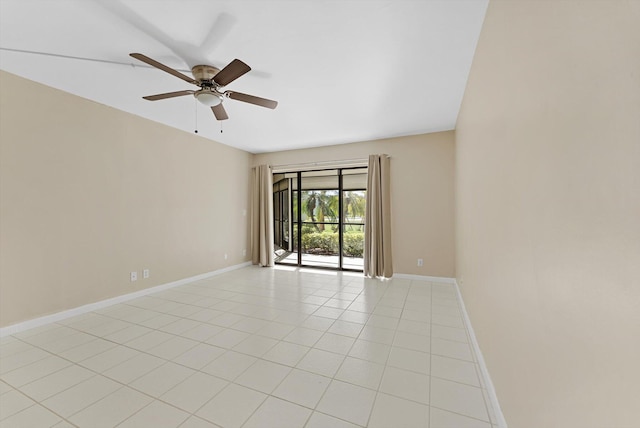 unfurnished room with light tile patterned floors, baseboards, and ceiling fan