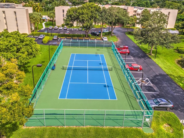 view of sport court with fence