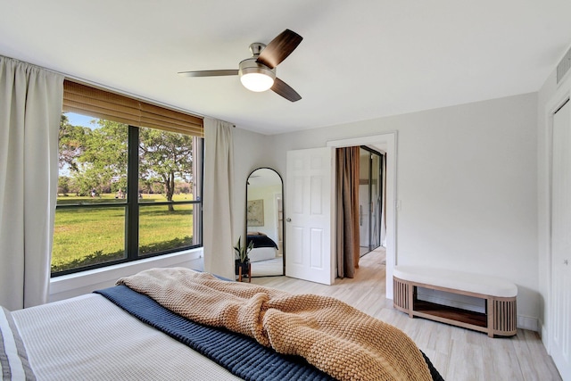 bedroom with light wood-style floors and ceiling fan