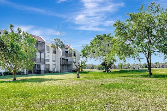 view of home's community featuring a lawn