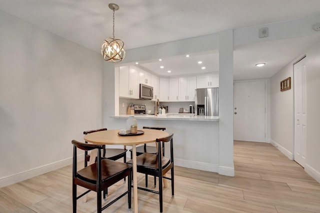 6451 N University Dr Unit 122, Tamarac, FL 33321 - bedroom featuring ensuite bathroom, baseboards, a ceiling fan, and wood finished floors