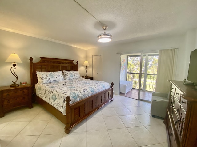 7185 Huntington Ln Unit 405, Delray Beach, FL 33446 - bedroom featuring access to exterior, light tile patterned flooring, and a textured ceiling