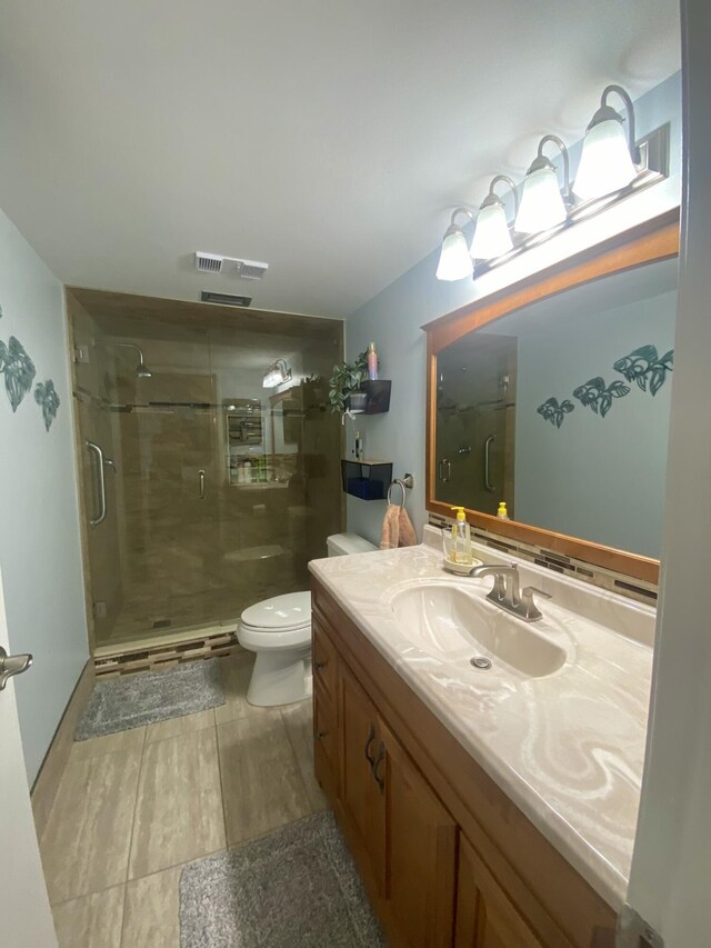 7185 Huntington Ln Unit 405, Delray Beach, FL 33446 - bathroom featuring toilet, vanity, a stall shower, and wood finished floors