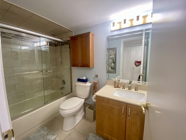7185 Huntington Ln Unit 405, Delray Beach, FL 33446 - full bathroom with toilet, vanity, combined bath / shower with glass door, and tile patterned floors