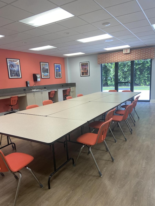 office area featuring a paneled ceiling and wood finished floors