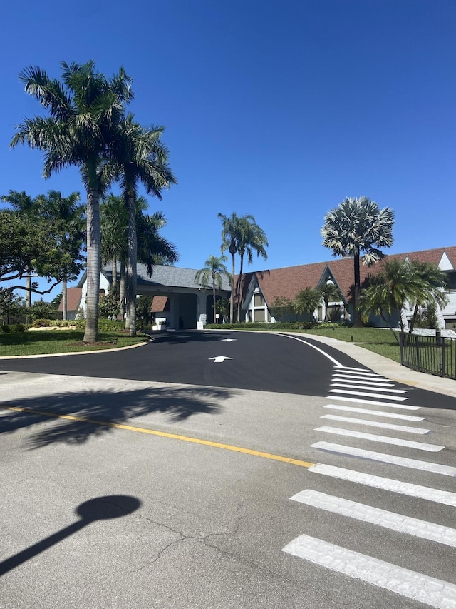 7185 Huntington Ln Unit 405, Delray Beach, FL 33446 - view of asphalt road featuring sidewalks and curbs