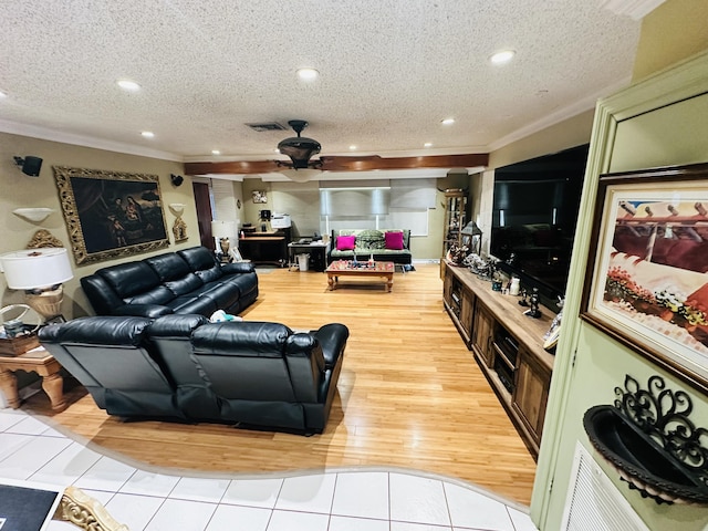 living area with crown molding, light wood-type flooring, recessed lighting, a textured ceiling, and a ceiling fan