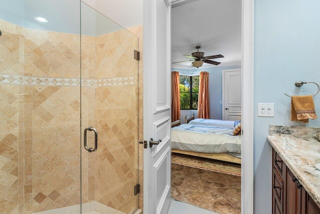 2161 NW 59th St, Boca Raton, FL 33496 - ensuite bathroom with vanity, a ceiling fan, tile patterned flooring, a shower stall, and ensuite bathroom