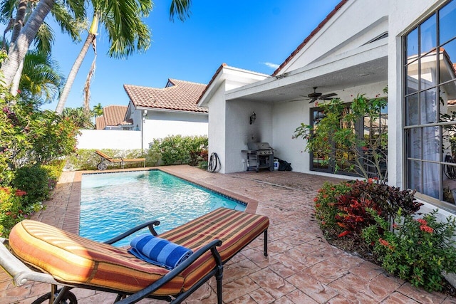 2161 NW 59th St, Boca Raton, FL 33496 - view of pool with grilling area, a fenced in pool, ceiling fan, fence, and a patio