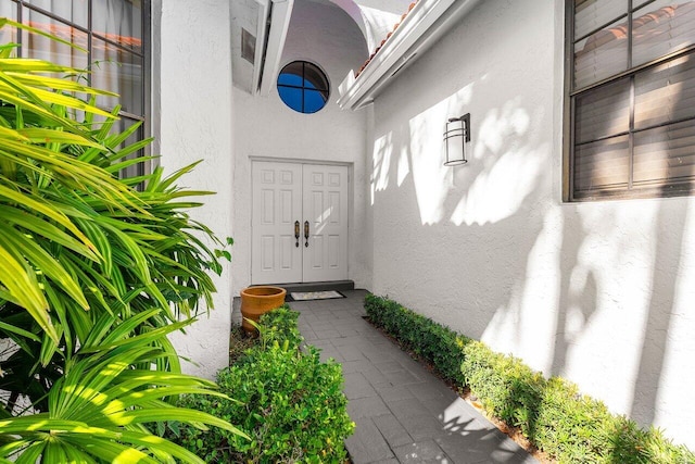 doorway to property with stucco siding