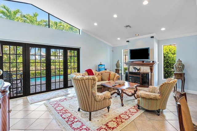 2161 NW 59th St, Boca Raton, FL 33496 - living room with visible vents, crown molding, baseboards, light tile patterned floors, and a glass covered fireplace