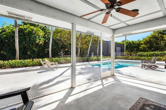 outdoor pool featuring ceiling fan and a patio area