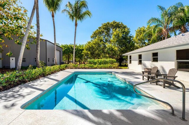 pool with a patio area