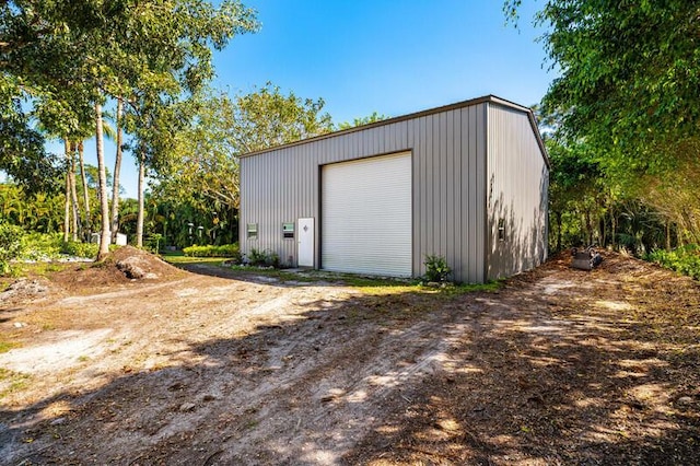 detached garage featuring driveway