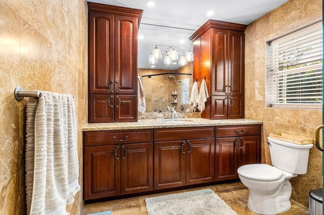 bathroom with toilet, recessed lighting, tile walls, tiled shower, and vanity