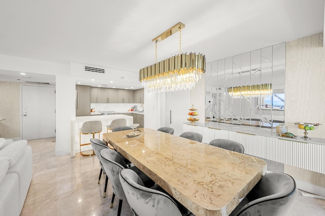 dining room featuring light tile patterned flooring, recessed lighting, visible vents, and a chandelier