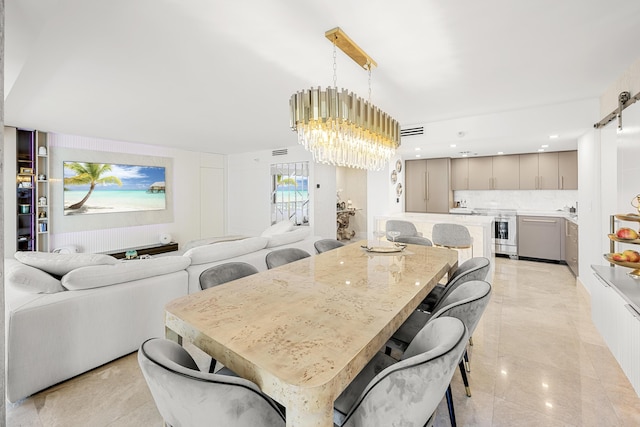 dining room featuring a chandelier and visible vents