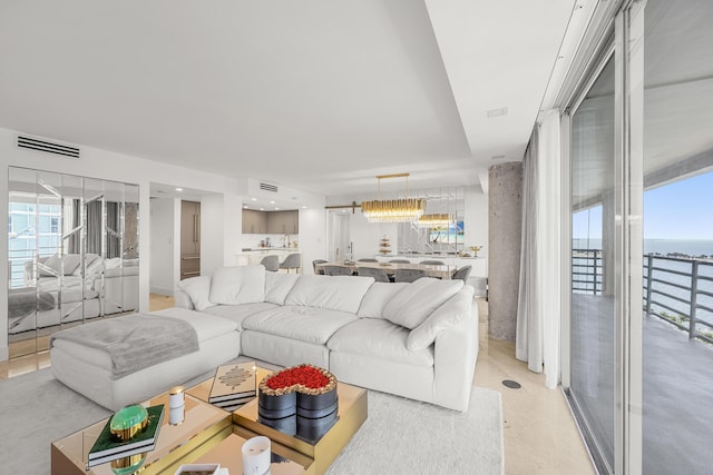 living area featuring visible vents and plenty of natural light