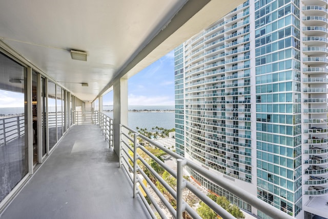 balcony featuring a water view