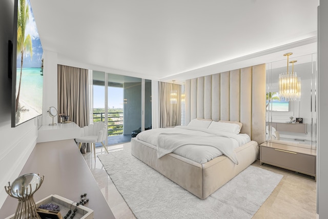 bedroom with floor to ceiling windows, access to outside, and a notable chandelier