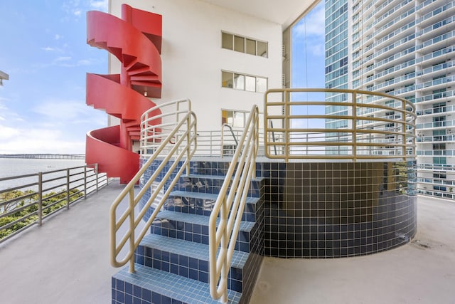 stairway featuring a water view