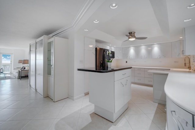 kitchen with a sink, a ceiling fan, white cabinetry, modern cabinets, and black appliances