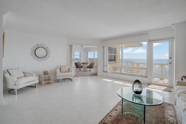 living area featuring tile patterned flooring and a textured ceiling