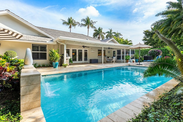 pool featuring ceiling fan, french doors, and a patio