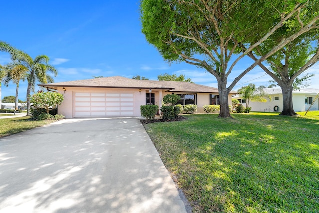 ranch-style house featuring a front lawn, an attached garage, concrete driveway, and stucco siding