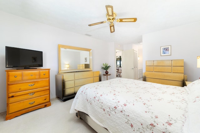 bedroom with light colored carpet and ceiling fan