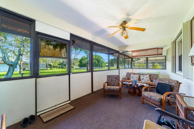 sunroom / solarium featuring ceiling fan