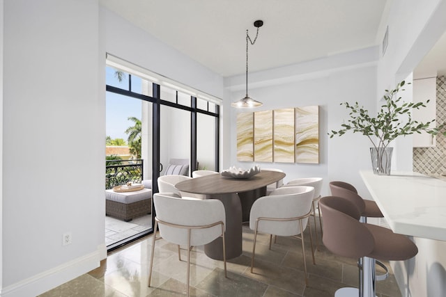 dining room featuring visible vents and baseboards