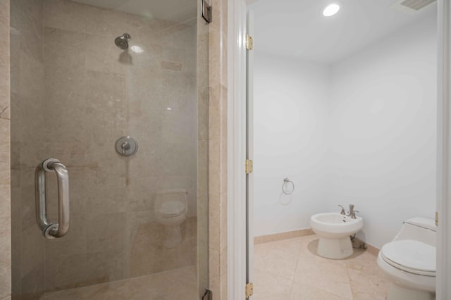 full bath with toilet, a bidet, a shower stall, tile patterned flooring, and baseboards