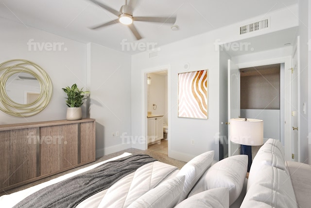 carpeted bedroom with a ceiling fan, baseboards, visible vents, and connected bathroom