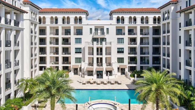 community pool with a patio area