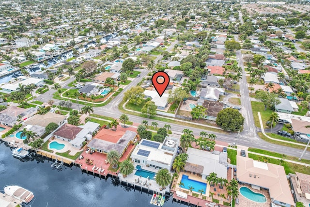 bird's eye view with a residential view and a water view