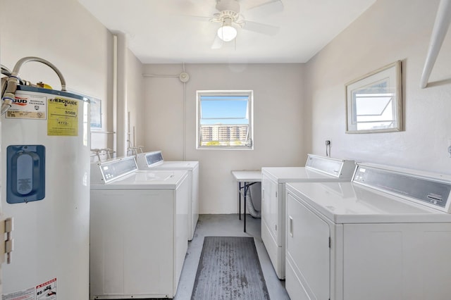 common laundry area with water heater, washing machine and dryer, and ceiling fan