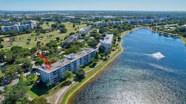 birds eye view of property featuring a city view and a water view