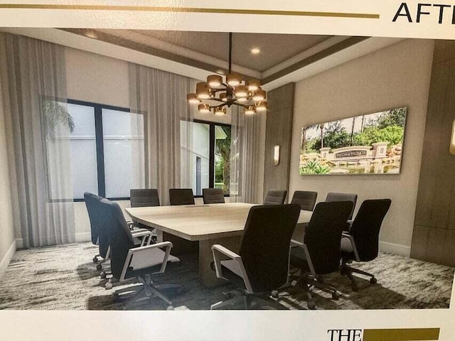 dining room featuring baseboards and a chandelier