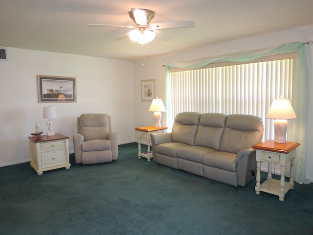 living room with visible vents, ceiling fan, and carpet flooring