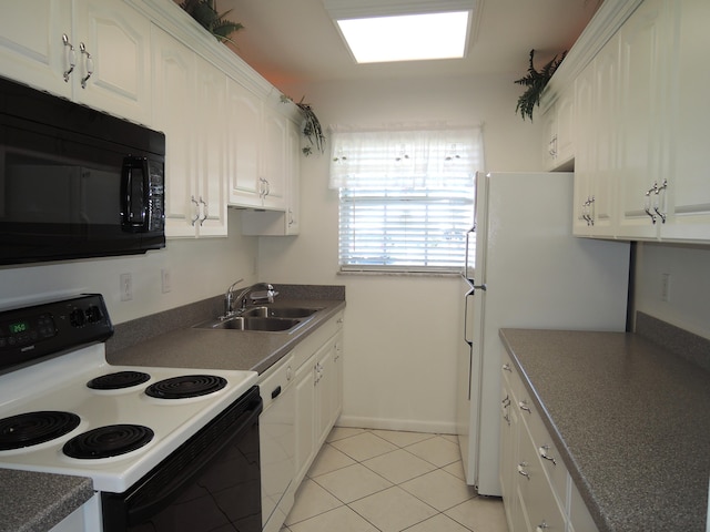 kitchen featuring white appliances, light tile patterned floors, baseboards, a sink, and white cabinetry