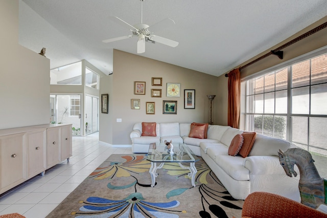 living area featuring light tile patterned floors, high vaulted ceiling, and ceiling fan