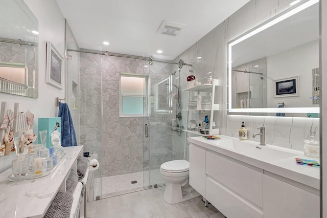 6089 Bay Isles Dr, Boynton Beach, FL 33437 - full bath featuring a marble finish shower, toilet, visible vents, and vanity
